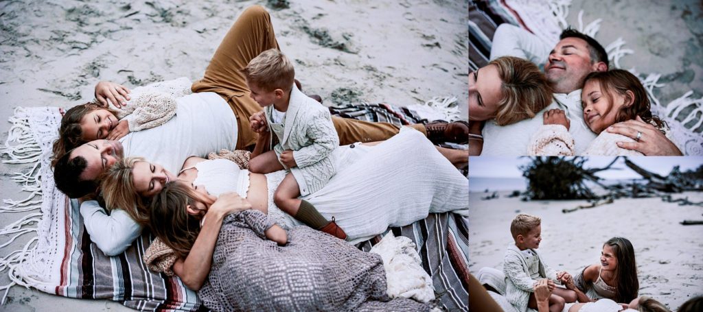 Family of five laying on the beach in Florida